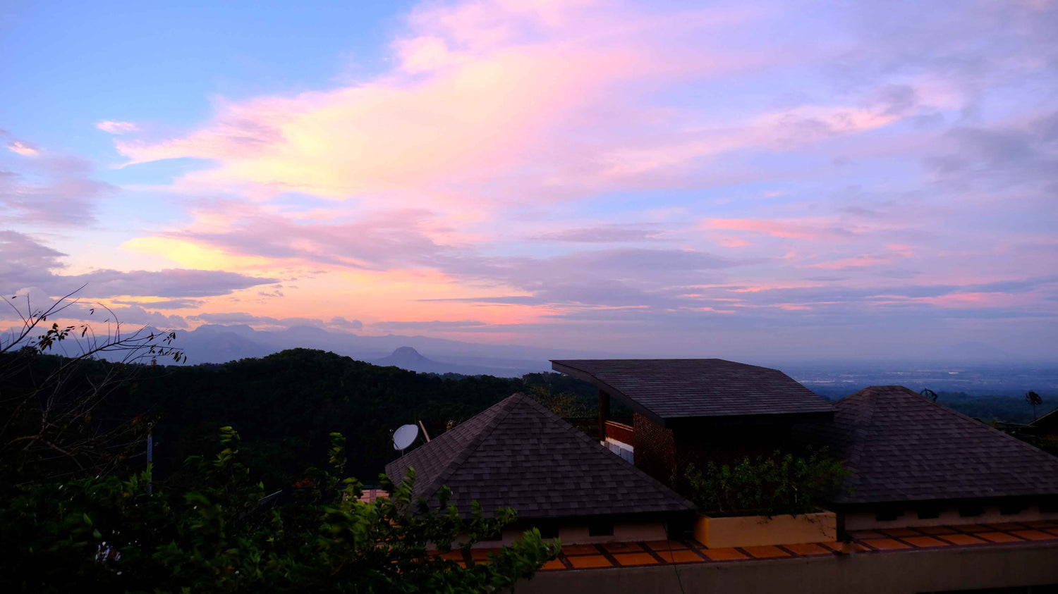 tanawin house and sunset sky with mt malasimbo