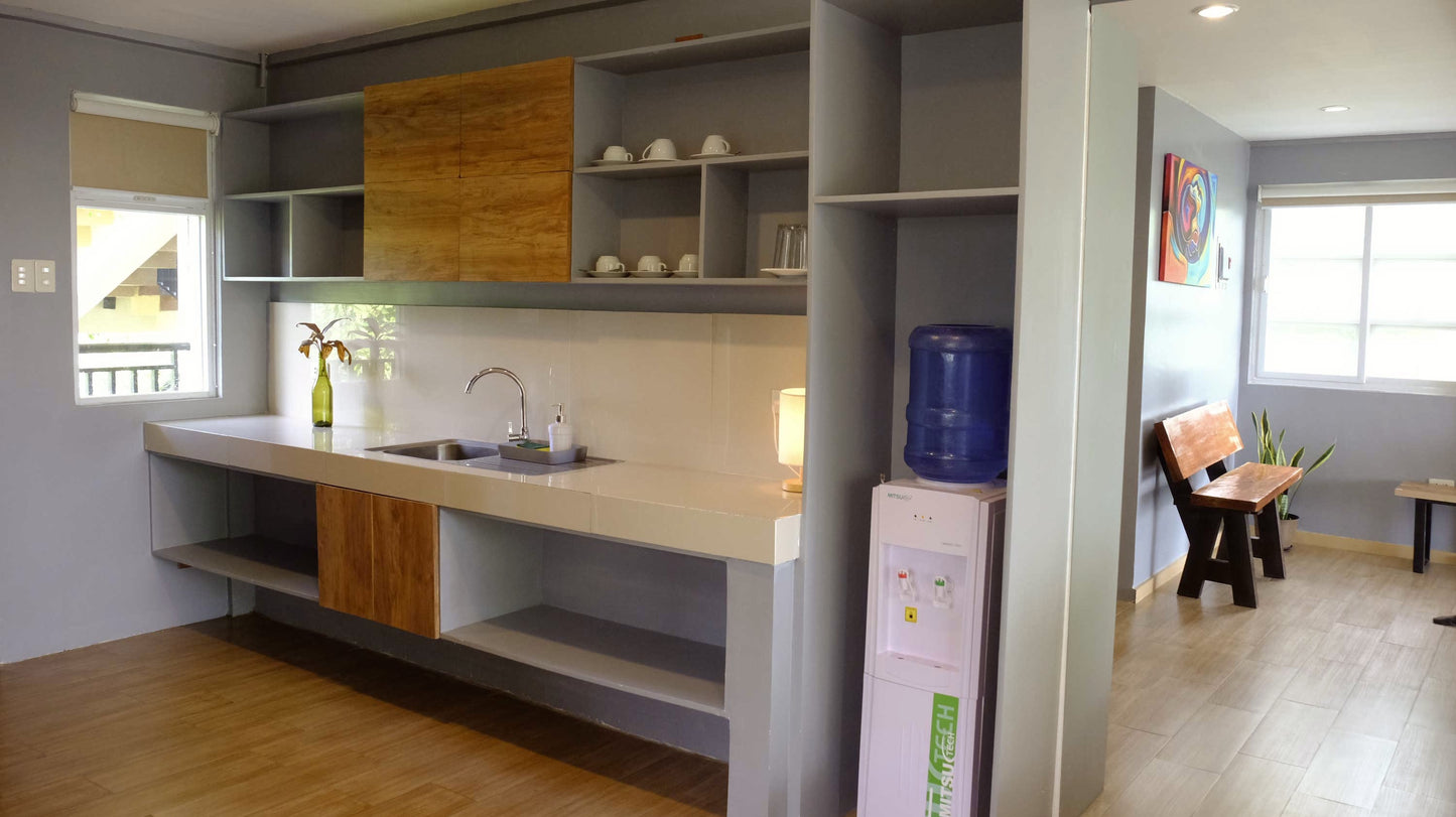 Wing room - with kitchenette, kitchen supplies, hot and cold water dispenser, refrigerator.