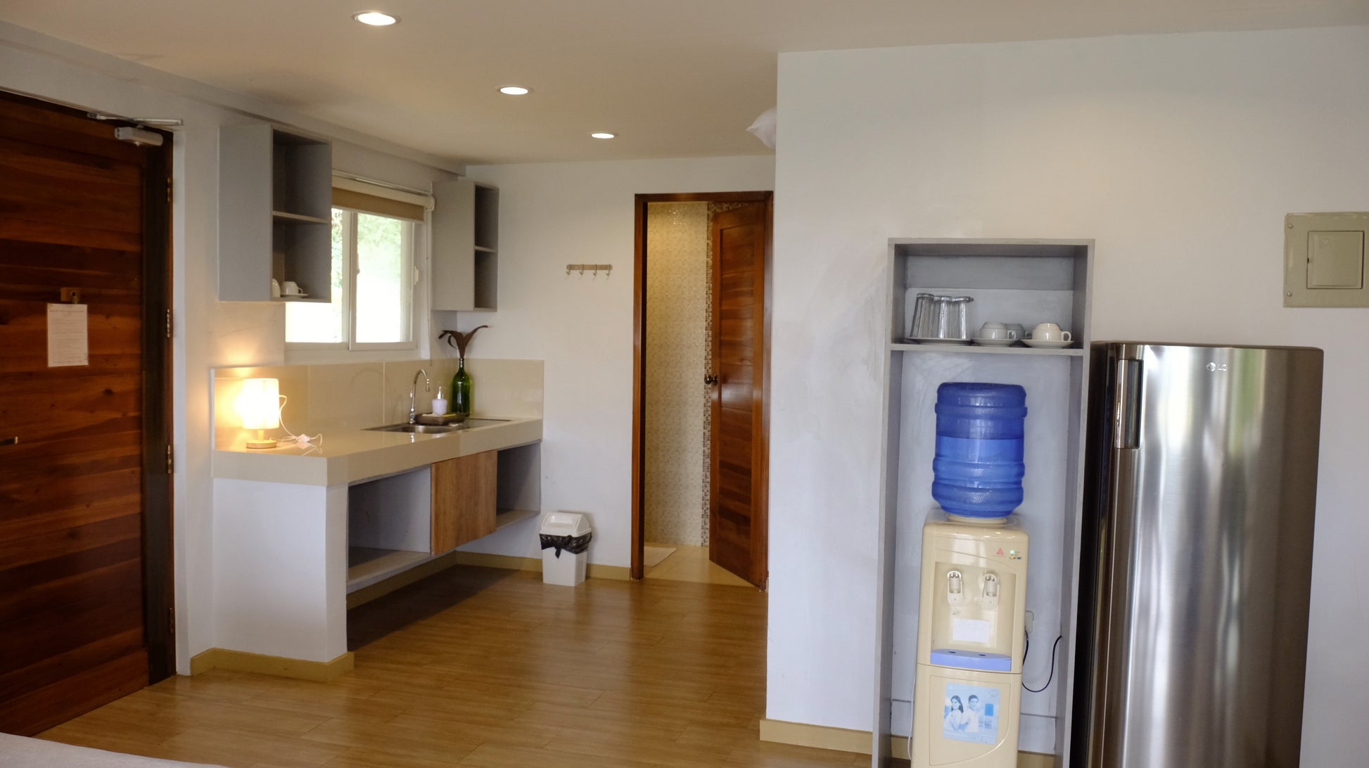 Kitchenette of Wing. Water dispenser, refrigerator, kitchen supplies. 